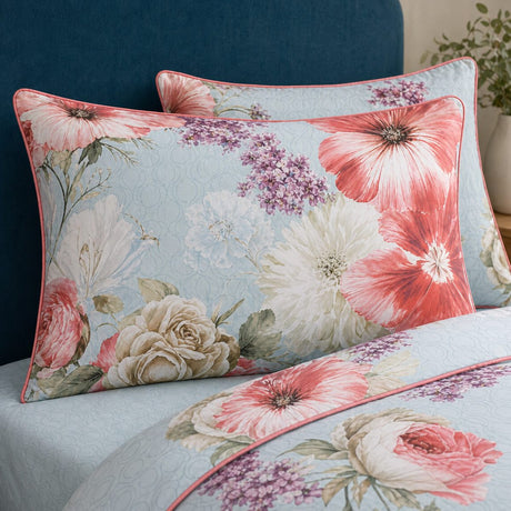 Close-up of Mayfair Lady cotton sateen pillowcases with oversized floral print and pink piping