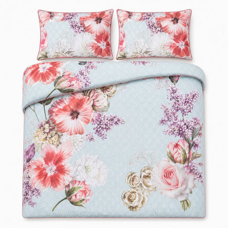 Overhead flat lay of the Mayfair Lady blue floral cotton duvet cover set with two pillows