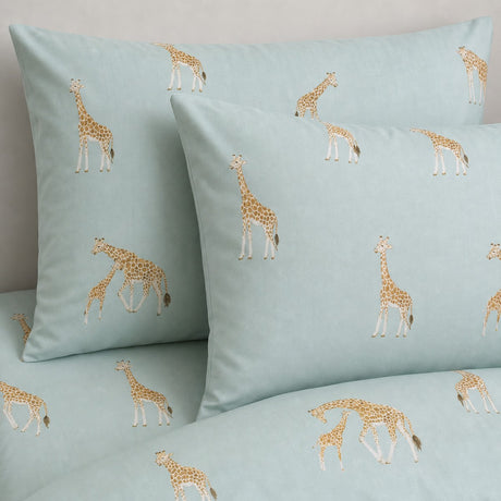 Close-up of Milo Giraffe Reversible Polycotton Duvet Cover Bedding Set in duck egg pillowcases showing the print and fabric detail
