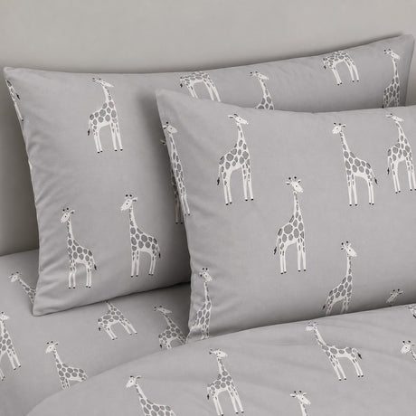 Close-up of Milo Giraffe Reversible Polycotton Duvet Cover Bedding Set in grey pillowcases showing the print and fabric detail
