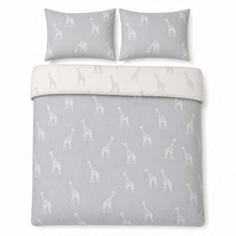 Overhead flat lay of the Milo Giraffe Reversible Polycotton Duvet Cover Bedding Set in grey with two matching pillowcases