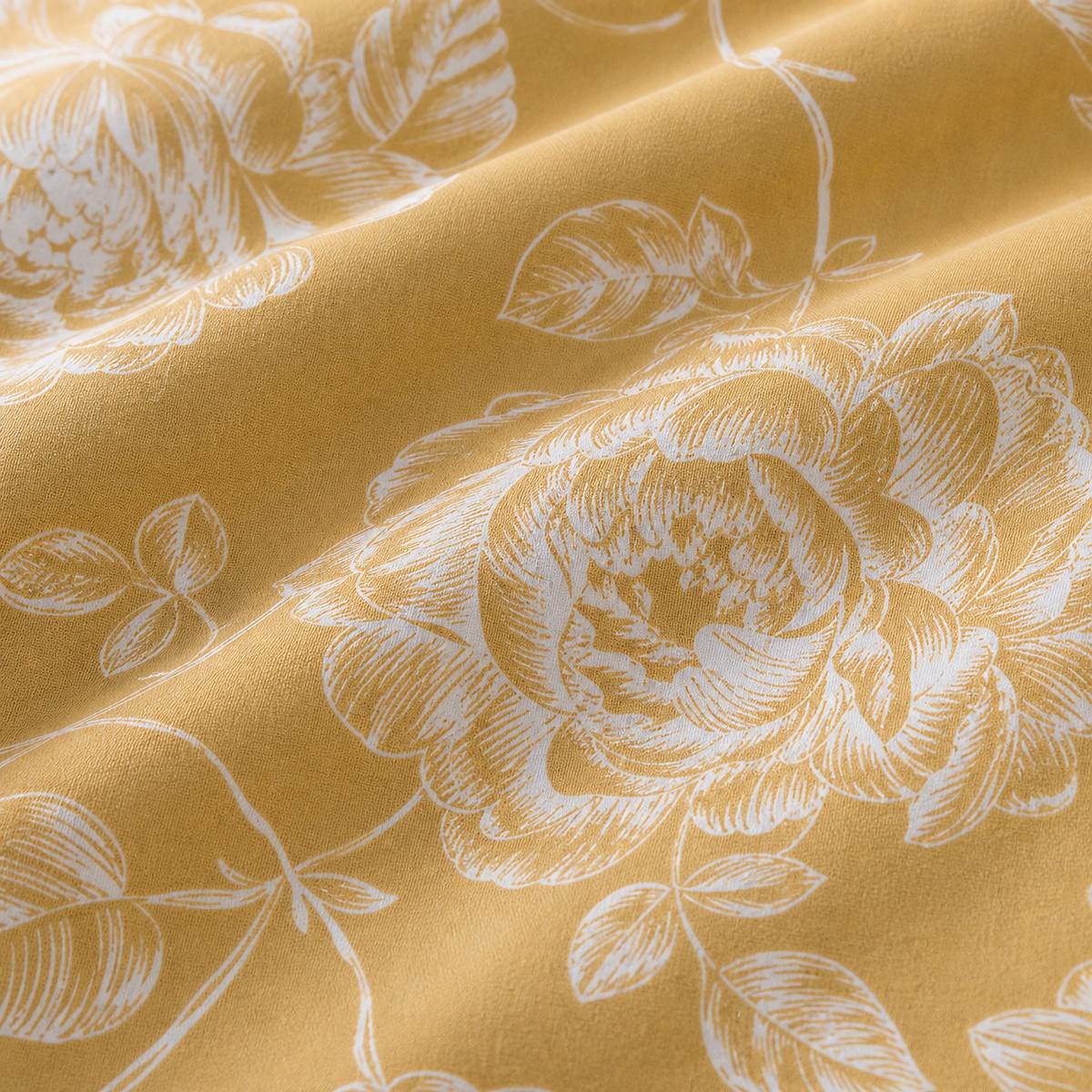 Macro close-up of the polycotton fabric on the Mishka Reversible Floral Gold Polycotton Duvet Cover Set