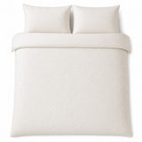 Overhead flat lay of the Montez Jacquard Beige duvet cover set with two matching pillowcases