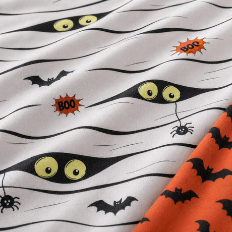 Macro close-up of Mummy polycotton fabric with bandage wrap eyes bats and spider print