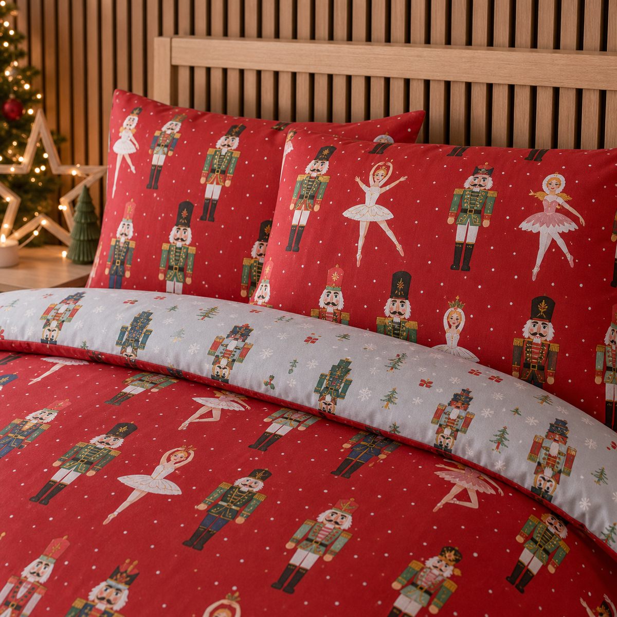 Close-up of matching Nutcracker Red Christmas Polycotton Duvet Cover Set pillowcases showing the pattern and fabric detail