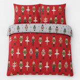 Overhead flat lay of the Nutcracker Red Christmas Polycotton Duvet Cover Set with two matching pillowcases