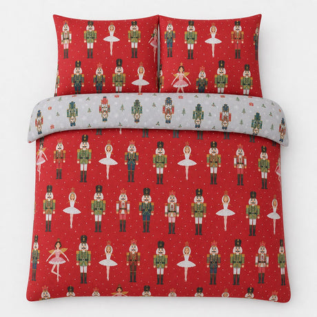 Overhead flat lay of the Nutcracker Red Christmas Polycotton Duvet Cover Set with two matching pillowcases
