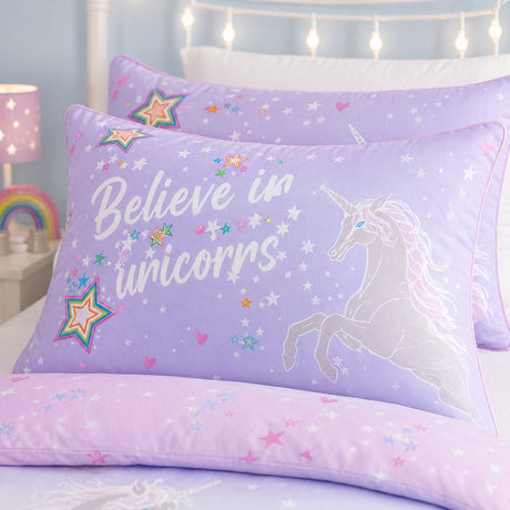 Close-up of the Ombre Unicorn lilac kids pillowcase with rainbow stars and unicorn print