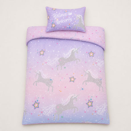 Overhead flat lay of the Ombre Unicorn lilac kids duvet cover set with matching pillowcase
