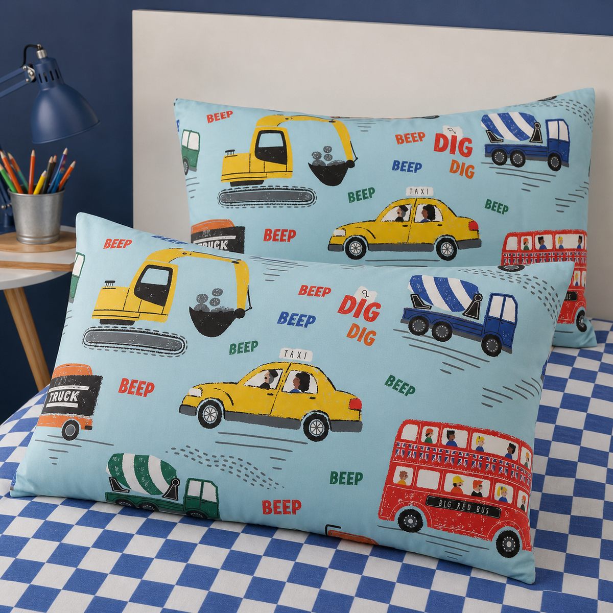 Close-up of matching On the Move Kids Transport Duvet Cover Set pillowcases showing the pattern and fabric detail
