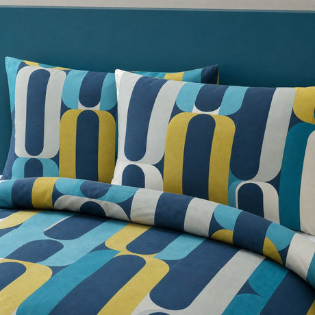 Close-up of Orea blue polycotton pillowcases showing the rounded geometric pattern
