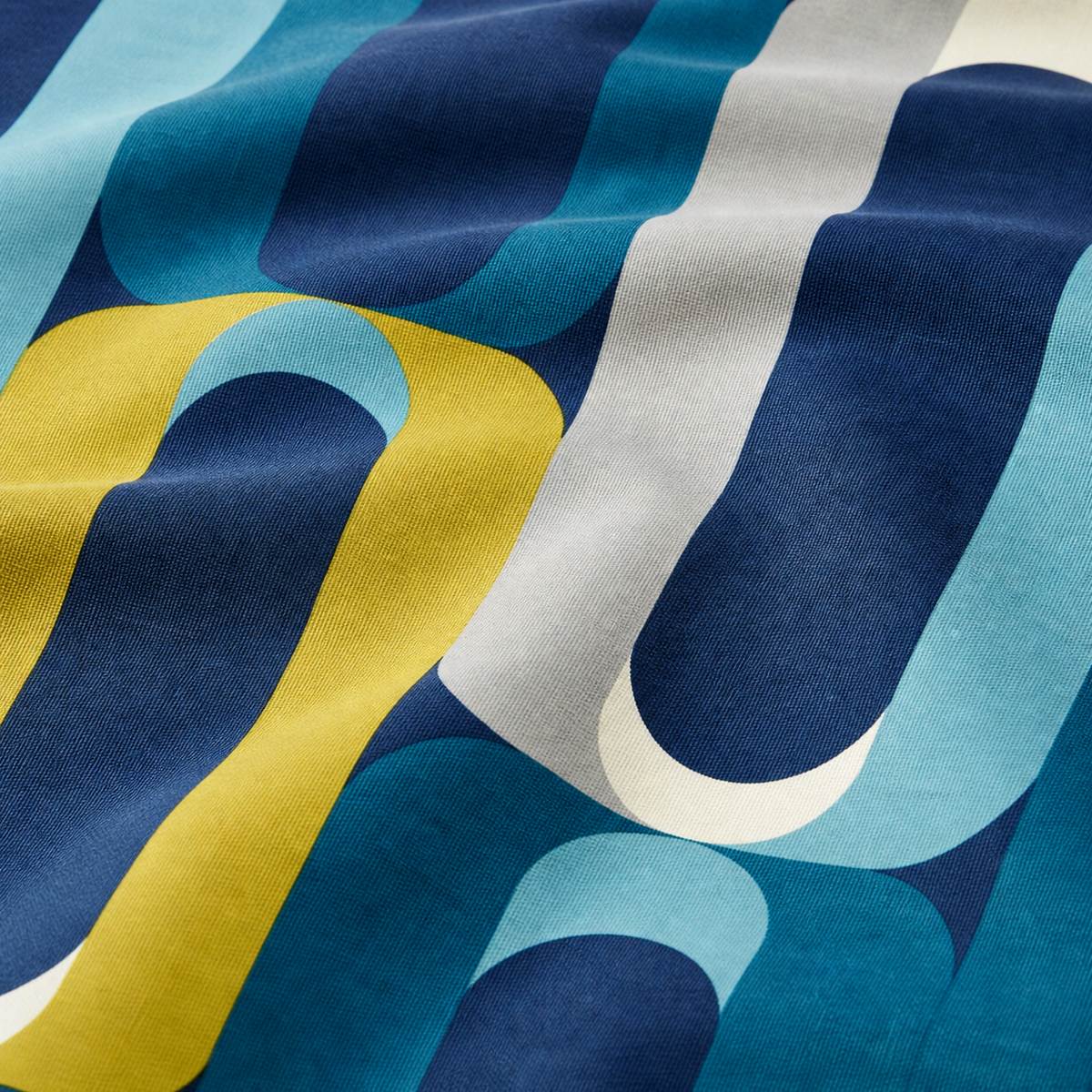 Macro close-up of the teal blue, navy and mustard Orea polycotton duvet cover fabric