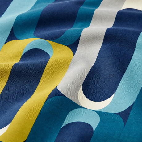 Macro close-up of the teal blue, navy and mustard Orea polycotton duvet cover fabric