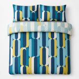 Overhead flat lay of the Orea blue reversible duvet cover set showing the lighter folded reverse side