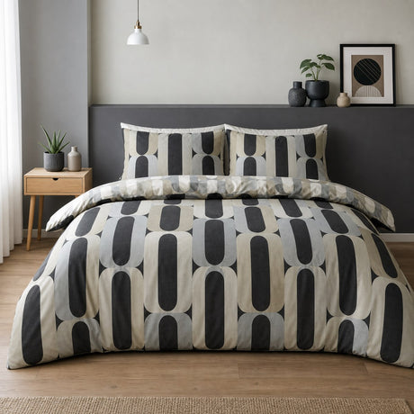 Orea charcoal geometric polycotton duvet cover set styled on a contemporary bedroom bed