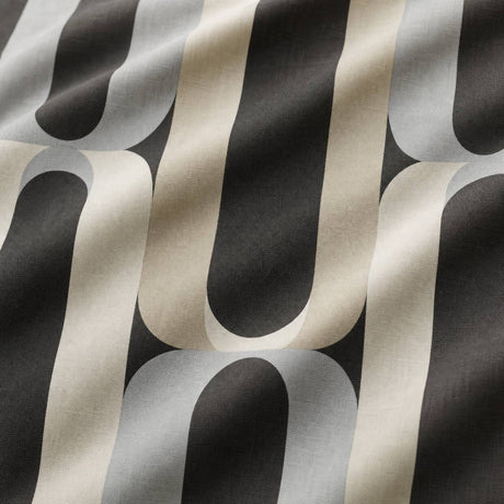Macro close-up of the charcoal grey and cream Orea polycotton duvet cover fabric