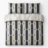 Overhead flat lay of the Orea charcoal reversible duvet cover set showing the lighter folded reverse side