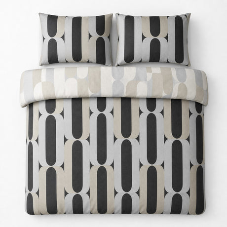 Overhead flat lay of the Orea charcoal reversible duvet cover set showing the lighter folded reverse side