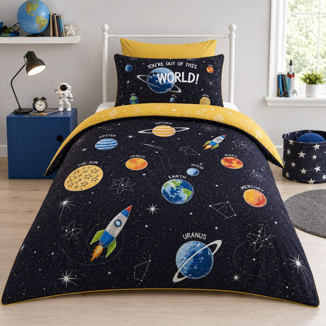 Outer Space black kids reversible duvet cover set styled on a bright child's bedroom bed with detailed planet print