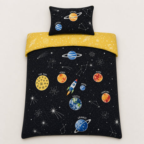 Overhead flat lay of the Outer Space kids reversible duvet cover set with detailed planet print