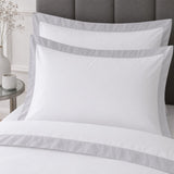 Close-up of matching Oxford Edge 100% Cotton White Duvet Cover Set pillowcases showing the pattern and fabric detail