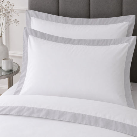 Close-up of matching Oxford Edge 100% Cotton White Duvet Cover Set pillowcases showing the pattern and fabric detail