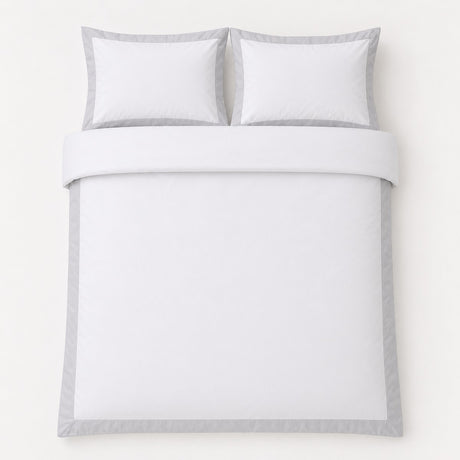 Overhead flat lay of the Oxford Edge 100% Cotton White Duvet Cover Set with two matching pillowcases