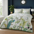 Peacock Jungle green polycotton duvet cover set styled on a bedroom bed