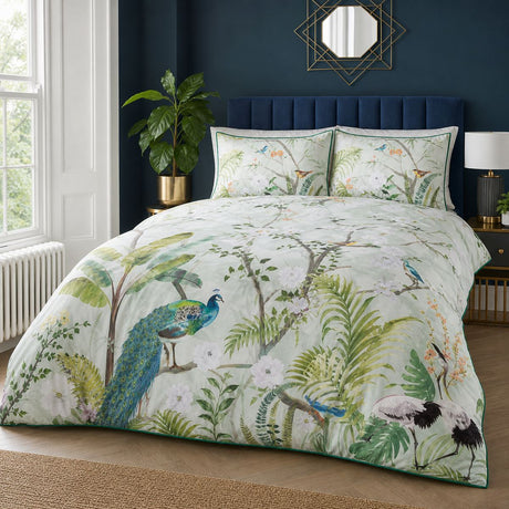 Peacock Jungle green polycotton duvet cover set styled on a bedroom bed