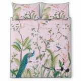 Overhead flat lay of the Peacock Jungle pink duvet cover set with two matching pillowcases