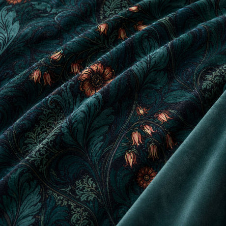 Macro close-up of Rambleicious teal velvet fabric with dark botanical leaves and coral flowers
