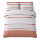 Overhead flat lay of the Rico Polycotton Duvet Cover Set in natural with two matching pillowcases