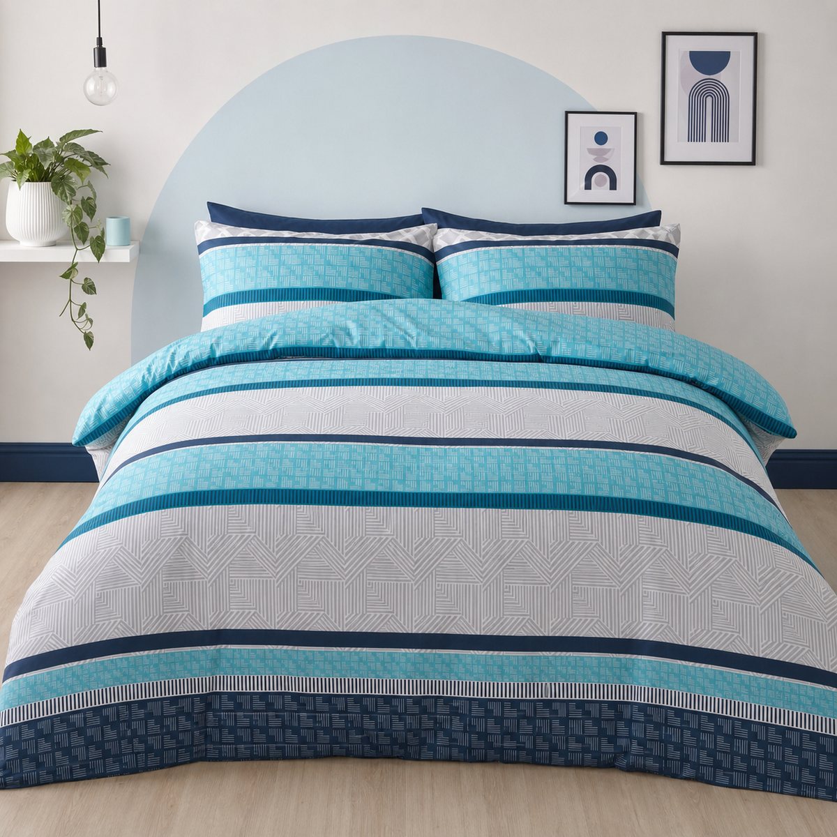Rico Polycotton Duvet Cover Set in teal styled on a coordinated bedroom bed