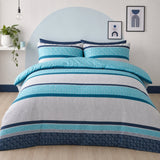 Rico Polycotton Duvet Cover Set in teal styled on a coordinated bedroom bed