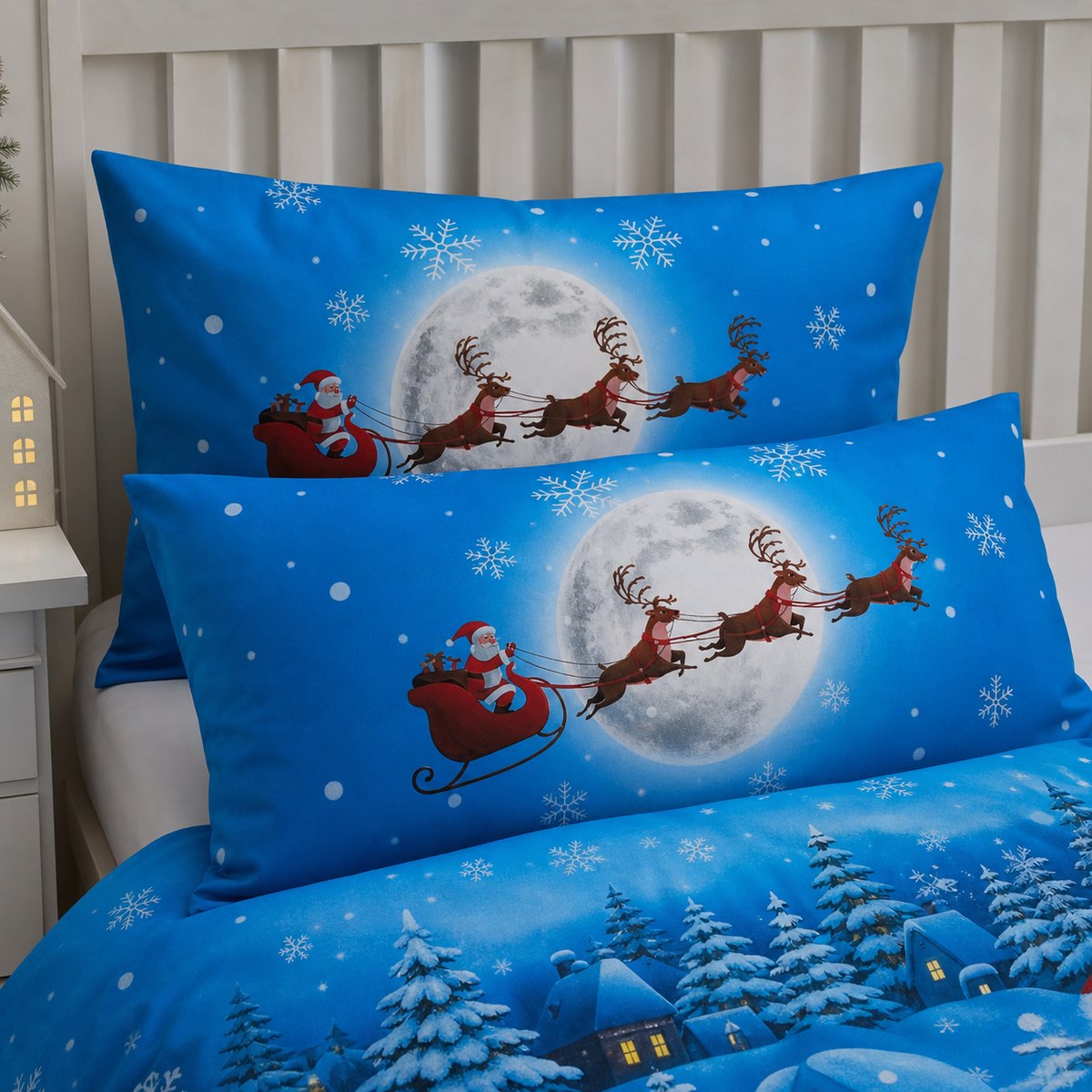Close-up of matching Santa Glow in the Dark Christmas Polycotton Duvet Cover Set pillowcases showing the pattern and fabric detail