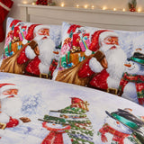 Close-up of matching Santa & Snowy Christmas Polycotton Duvet Cover Set pillowcases showing the pattern and fabric detail