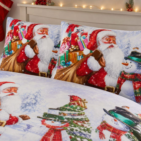 Close-up of matching Santa & Snowy Christmas Polycotton Duvet Cover Set pillowcases showing the pattern and fabric detail