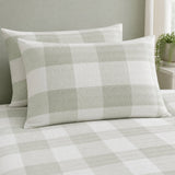 Close-up of Seersucker Gingham green pillowcases showing the raised puckered check texture