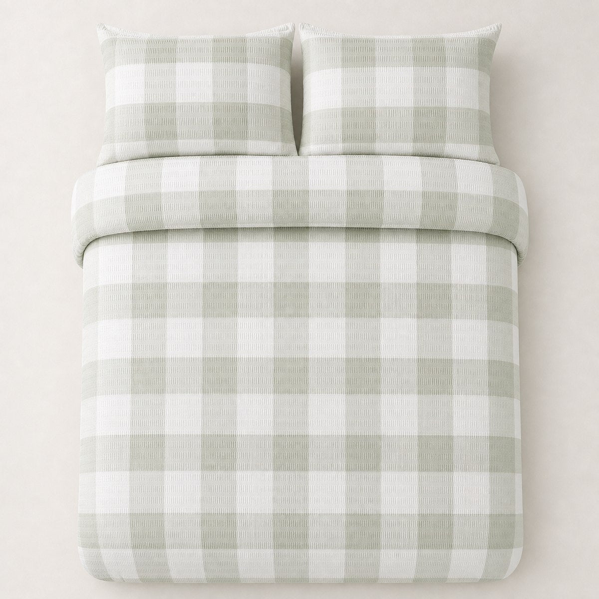 Overhead flat lay of the Seersucker Gingham green duvet cover set with two matching pillowcases