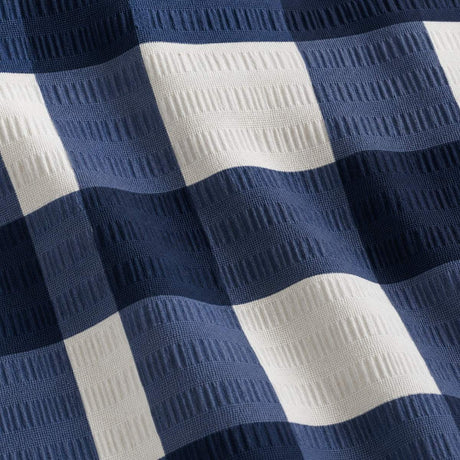 Macro close-up of the Seersucker Gingham navy polycotton seersucker fabric