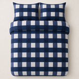 Overhead flat lay of the Seersucker Gingham navy duvet cover set with two matching pillowcases