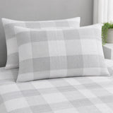 Close-up of Seersucker Gingham silver pillowcases showing the raised puckered check texture