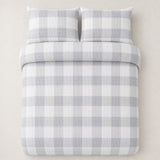 Overhead flat lay of the Seersucker Gingham silver duvet cover set with two matching pillowcases