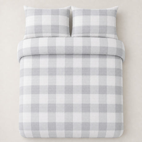 Overhead flat lay of the Seersucker Gingham silver duvet cover set with two matching pillowcases