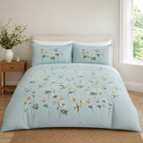 Serenity duck egg floral cotton duvet cover set styled on a bright bedroom bed