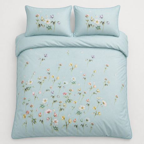 Overhead flat lay of Serenity duck egg floral duvet cover set with two pillows
