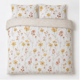 Overhead flat lay of the Sienna 100% Cotton Duvet Cover Set in gold with two matching pillowcases