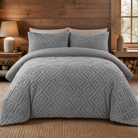 Snug Romo grey cosy fleece duvet cover set styled on a warm modern bedroom bed