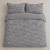 Overhead flat lay of the grey Romo fleece duvet cover set with two matching pillowcases