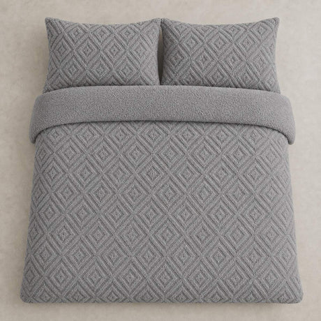 Overhead flat lay of the grey Romo fleece duvet cover set with two matching pillowcases